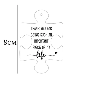 Acrylic puzzle piece car charm with heart motif and inspirational thank you message