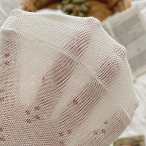 White breathable mesh knit socks for women with delicate floral jacquard patterns