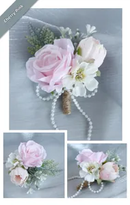 Detail of cherry pink rose boutonniere with daisy, pearl chain, and jute rope handle