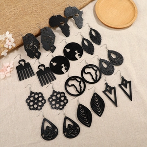 Set of 9 pairs of black hollow wood earrings with African geometric patterns and map shapes
