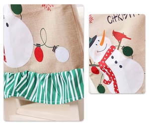 Detail of Christmas chair cover showing linen texture with snowman and green striped ruffle