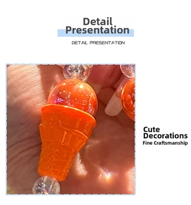 Detail of beaded keychain with orange ice cream cone pendant and glittery beads