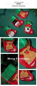 Detail of Christmas stocking with cartoon reindeer, snowman figures and green sequins