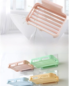 Detail of wall-mounted self-draining soap holder with four color options and adhesive pad