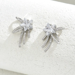 Star-shaped silver stud earrings with sparkling cubic zirconia meteor trail design