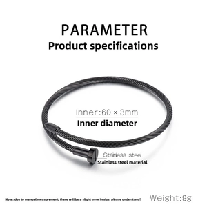 Detail of matte black cable twist stainless steel bangle with nail-head ends