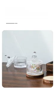 Detailed macro view of clear ribbed glass jars with lids for candy or jewelry storage