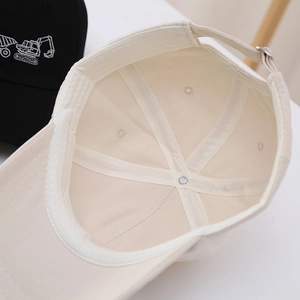 Detail of kids baseball cap inner structure with metal buckle and excavator embroidery