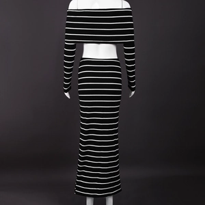 Detail view of the striped knit texture on the off-shoulder top and bodycon skirt set