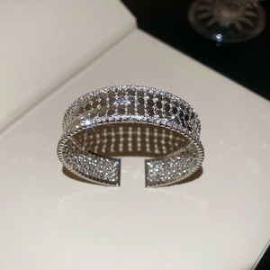 Macro detail of multi-row silver cuff bangle with sparkling cubic zirconia settings
