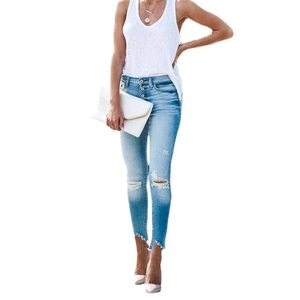 Women's light blue distressed skinny jeans with ripped knees and button fly closure