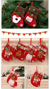 Detailed Christmas stockings with 3D Santa, reindeer, and bells hanging on tree