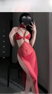 Detail of red sexy lingerie set featuring mesh fabric and high slit long skirt