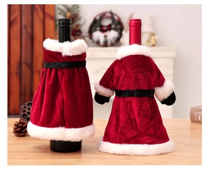 Detail of red velvet Christmas wine bottle covers with white fur trim and black belt design