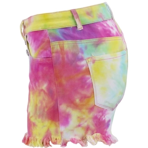 Detail view of colorful tie-dye high-waist denim shorts with frayed hems and fringe edges