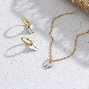 Golden stainless steel necklace and earrings set featuring white shell butterfly pendants
