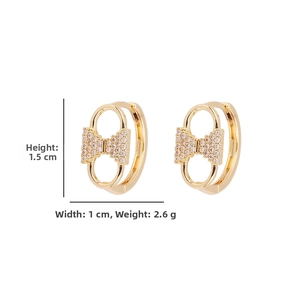 Detailed size view of gold bow earrings with micro-set cubic zirconia 1.5cm height
