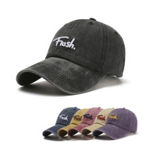Detail showing vintage washed cotton baseball caps with embroidered Flash logo in various colors