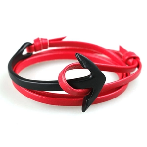 Detail view of red multi-layer leather cord with a black metal anchor hook clasp