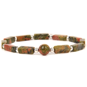 Macro detail of natural unakite stone beads with unique green and orange textures