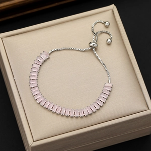 Detail of pink rectangular zircon bracelet with adjustable silver-tone sliding box chain