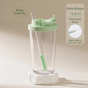 Detail view of 710ml pale green Tritan cup with large telescopic straw for bubble tea