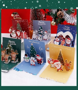 Detailed view of 3D pop-up Christmas cards featuring Santa, Reindeer, and holiday themes