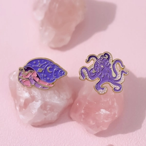 Cartoon purple octopus and seashell enamel pins on pink crystals for women