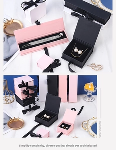 Detailed display of assorted matte jewelry gift boxes with elegant black silk ribbons