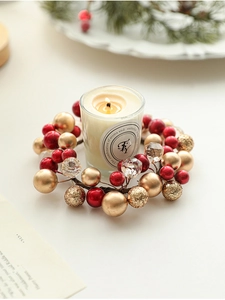 Detail of Christmas candle ring with red berries, gold beads, and clear crystal accents