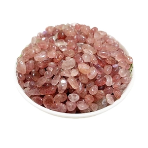 Natural strawberry quartz crystal chips in a white bowl for DIY jewelry and home decor
