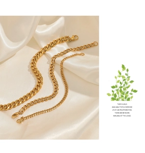 Detailed comparison of three polished gold Cuban chains in varying thicknesses on silk