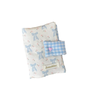 Cute fabric book cover with blue bow and pink floral pattern featuring heart clasp buckle