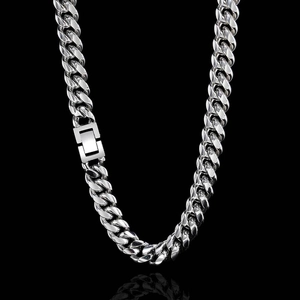 Detail shot of heavy stainless steel Cuban chain necklace with geometric square clasp