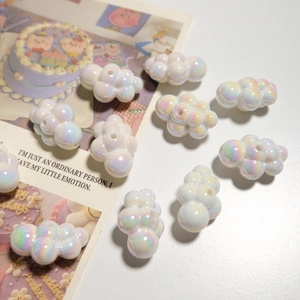 Lustrous white cloud beads for DIY jewelry and necklaces on aesthetic background