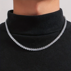Hip-hop silver tennis necklace with square cut zircon crystals on a black turtleneck