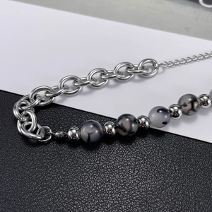 Unisex stainless steel chain bracelet with silver metal links and grey textured stone beads
