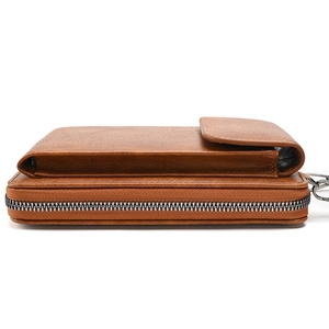 Brown leather multipurpose phone bag and crossbody wallet showing side view storage layers
