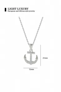 Detail view of silver anchor pendant with crystals and dimensions of 21mm by 15mm