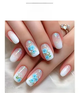 Detailed view of short square press-on nails with blue 3D flowers and glitter gradient