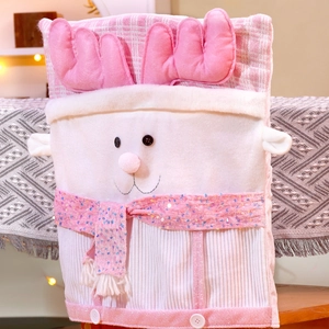 Detail of a pink plush reindeer chair cover with soft antlers and festive sequin scarf