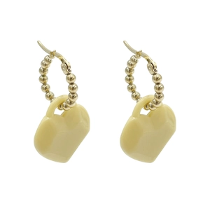 Cute heart-shaped acrylic hoop earrings in gold finish and cream yellow pendant