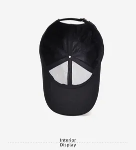 Detail of black baseball cap interior with mesh lining and adjustable metal buckle