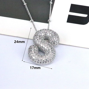Silver tone bubble letter S necklace with cubic zirconia and dimensions 24mm x 17mm
