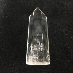 Macro shot of natural white crystal column showing internal inclusions and ice cracks