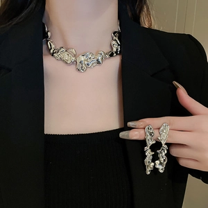 Irregular lava design silver necklace and earrings set with metallic melting texture