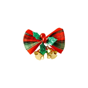 Christmas plaid bow decoration with red berries, green leaves and gold bells