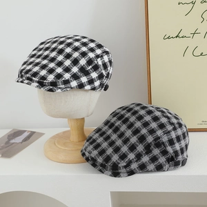Classic checkered newsboy caps for children in black and white tweed fabric