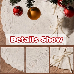 Knitted Christmas tree skirt in cream white with ribbon bows on wooden floor