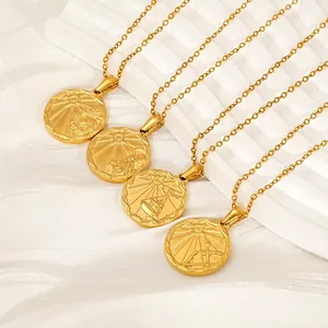 Minimalist 18k gold plated stainless steel zodiac coin necklaces on white display
